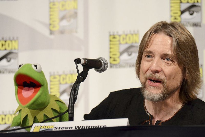 In this July 11, 2015, file photo, Kermit the Frog, left, and puppeteer Steve Whitmire attend "The Muppets" panel on day 3 of Comic-Con International in San Diego. 