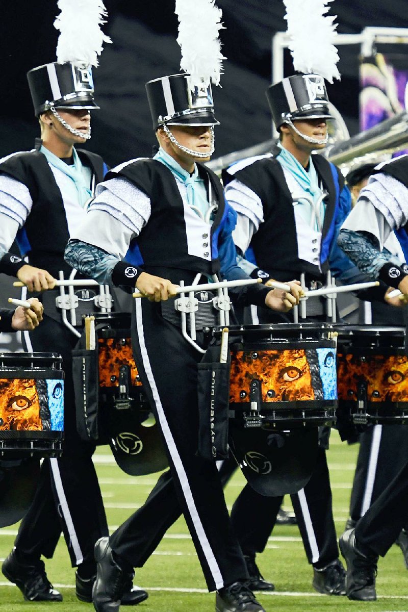 Touring drum corps from across the country perform Monday in Bentonville and July 26 in Little Rock.
