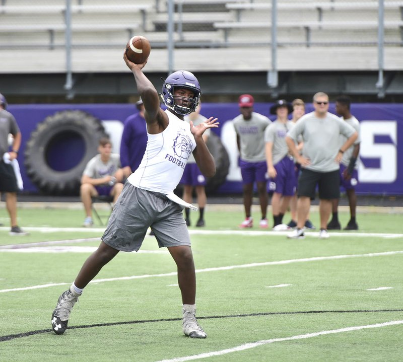Fayetteville quarterback Darius Bowers throws a pass Friday during the Southwest Elite 7-on-7 tournament at Harmon Field on the campus of Fayetteville High School.