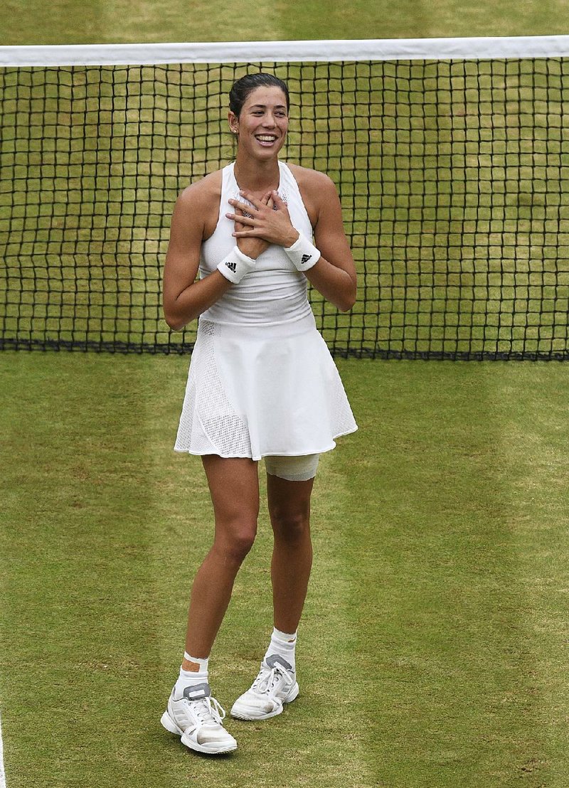 Although it is no longer a tradition at Wimbledon, Garbine Muguruza would like to share a champions dance with Roger Federer. 