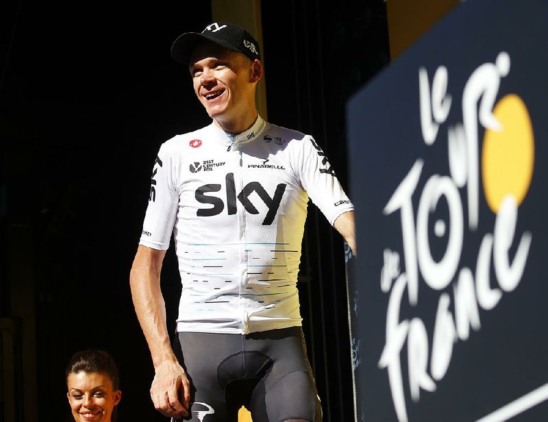 Britain's Chris Froome, arrives on the podium after the fourteenth stage of the Tour de France cycling race over 181.5 kilometers (112.8 miles) with start in Blagnac and finish in Rodez, France, Saturday, July 15, 2017.