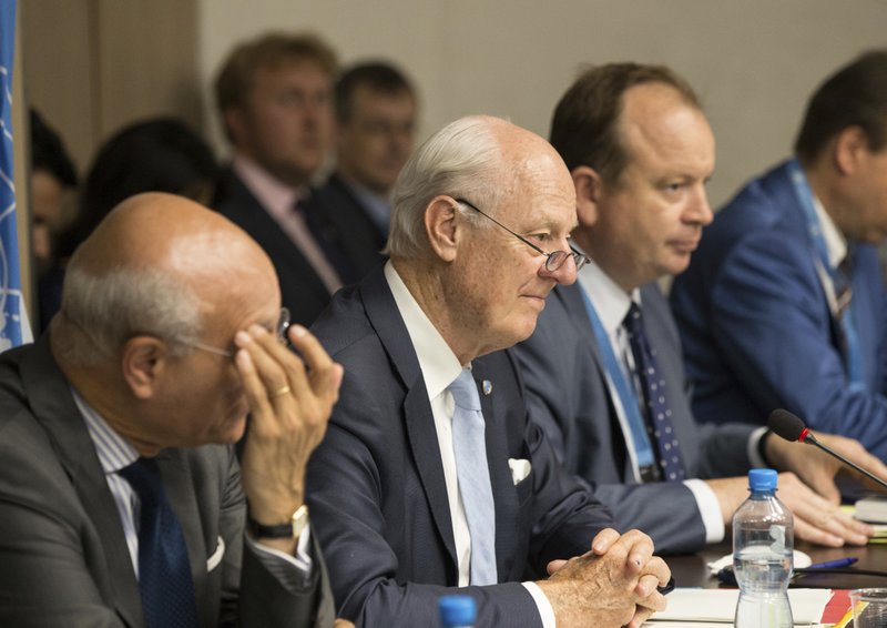 Special Envoy of the Secretary-General for Syria Staffan de Mistura, second left, attends a new round of negotiation with Syria's main opposition High Negotiations Committee (HNC) leader Nasr al-Hariri during the Intra Syria talks, at Palais des Nations in Geneva, Switzerland, Friday, July 14, 2017. (Xu Jinquan/Pool Photo via AP)