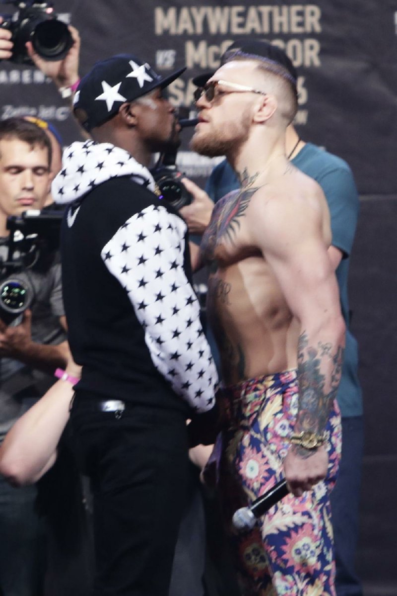 Floyd Mayweather (left) and Conor McGregor have gone from the standard prefight garbage to exchanges with
homophobic and racist overtones.