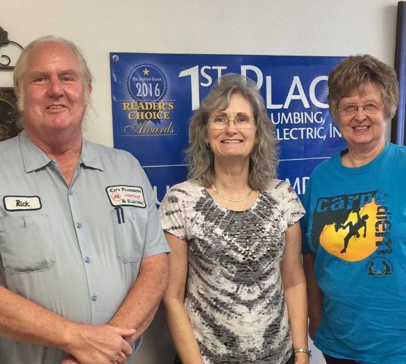 Submitted photo Owners Rick Bonte, left, and Elwen Guthrie of City Plumbing, Heating & Electric presented Norine Westerbeck, Arkansas Blind Camp coordinator, with a $500 donation for this year's Blind Camp. The above owners, along with Ronnie Carroll, have also donated $500 to the Arkansas Food Bank for the Summer Cereal Drive, as part of their Giving Back to area nonprofit organizations. City Plumbing, Heating & Electric has donated more than $93,000 to area nonprofits since October 2009. For information, call City PH&E at 501-623-3325 or 501-922-3325, or visit the company's website, http://cityplumbingandelectric.com.