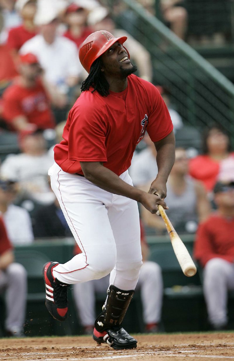 Former Major League Baseball player Vladimir Guerrero spent a long time admiring a home run he hit in a softball
game before heading around the bases.