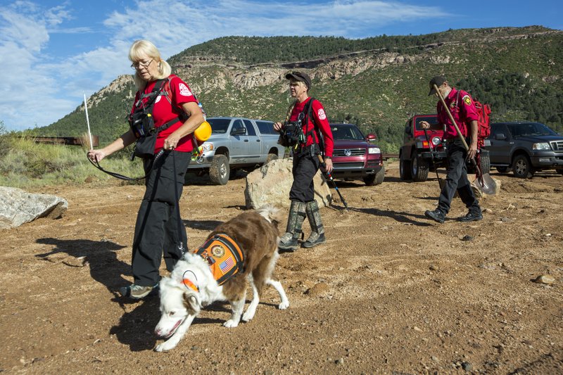 Volunteer rescuers from Navajo County begin searching for a missing 27-year-old man in Tonto National Forest, Ariz., Monday, July 17, 2017. The man was swept downriver with more than a dozen others when floodwaters inundated the area on Saturday. 