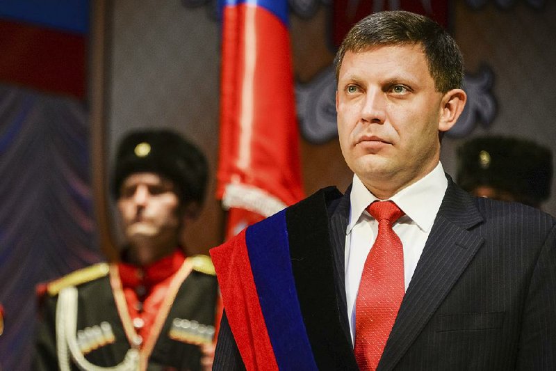  In this Tuesday, Nov. 4, 2014 file photo, rebel leader Alexander Zakharchenko stands during a swearing in ceremony in Donetsk, Ukraine. Separatists in eastern Ukraine on Tuesday, July 18, 2017 proclaimed a new state that aspires to include not only the areas they control but also the rest of the country. 