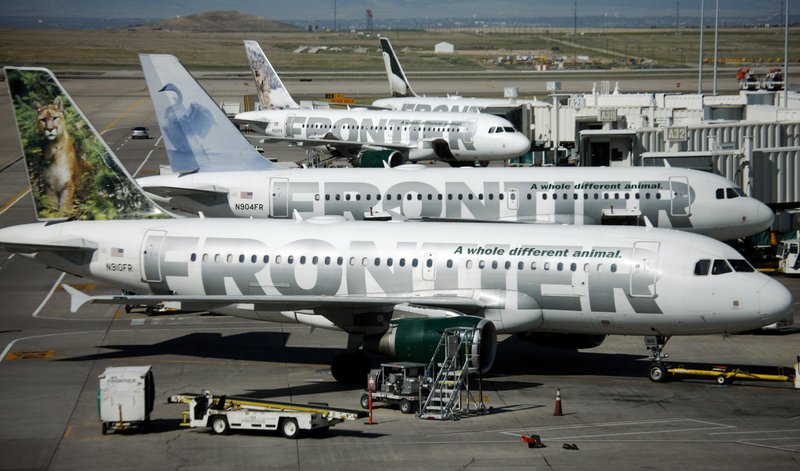 FILE - In this Sept. 22, 2008 file photo, Frontier Airlines planes sit stacked up outside gates on the A concourse in Denver. (AP Photo/David Zalubowski, file)
