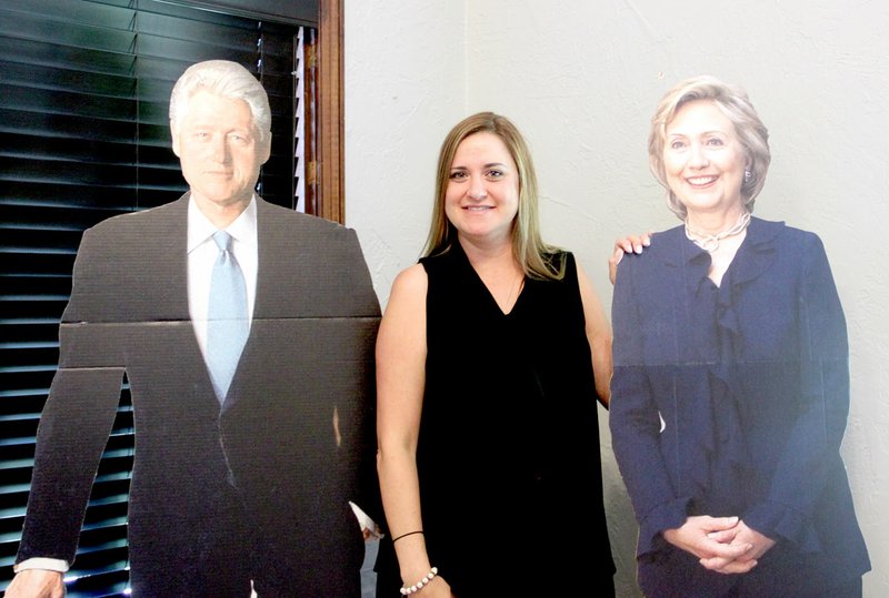 Andrea Jenkins, second-grade teacher at Williams Elementary School, stands with life-size cutouts of former President Bill Clinton and his wife, Hillary Clinton, also the Democratic nominee in the 2017 Presidential election.