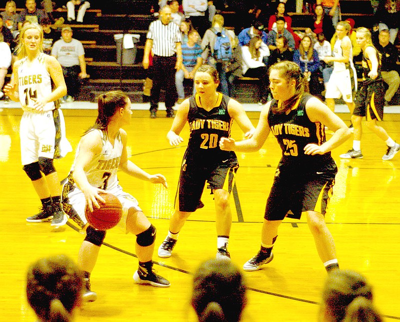 MARK HUMPHREY ENTERPRISE-LEADER Prairie Grove&#8217;s Camree Barthlomew (No. 20), shown double-teaming the ball with teammate Parker Lopez, received All-Conference honors for the Lady Tigers during her senior season. In 24 games, Bartholomew averaged 10.5 points, 2.2 rebounds, 1.3 assists, and 2.4 steals-per-contest.