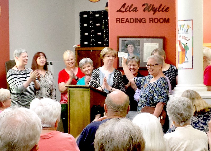 Photo submitted. The Friends of the Library presents their pledge to the Bella Vista Public Library Foundation for the library expansion.