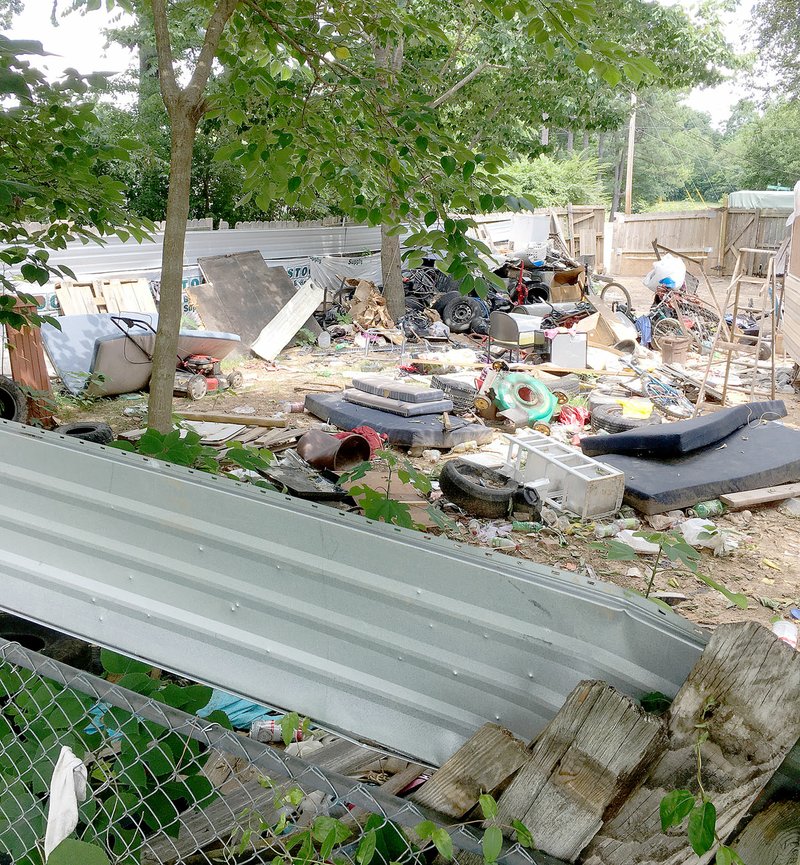 COURTESY PHOTO City of Farmington officials are in the process of getting this property cleaned up at 97 Double Springs Road. Neighbors have complained about the condition of the property since last fall.