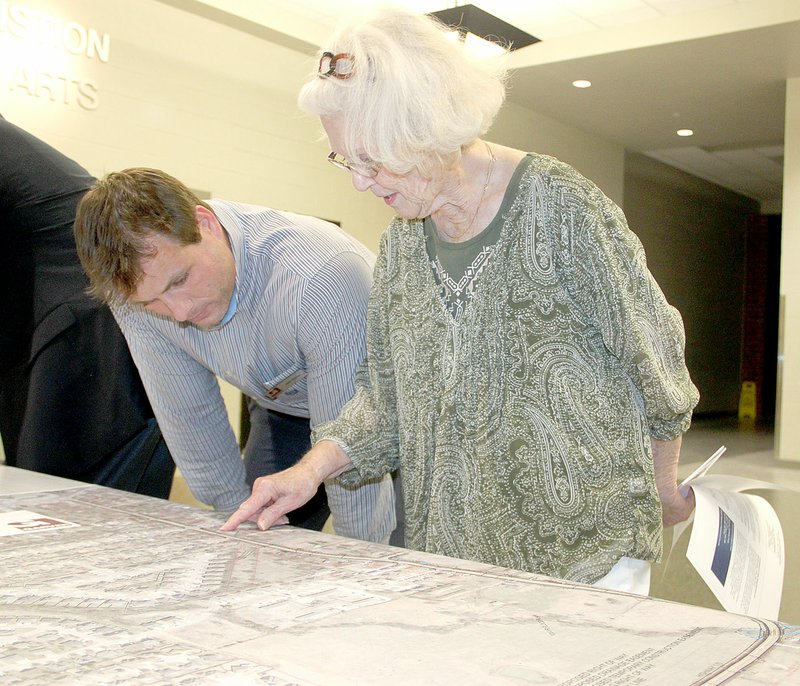 LYNN KUTTER ENTERPRISE-LEADER Yvonne Samples of Farmington talks to Zack Moore with Garver engineering firm during a public involvement meeting last week about the Highway 170 improvement project. A signup sheet showed 67 people attended the meeting to ask questions and make comments about the project design. Samples lives at the corner of North Haven and Highway 170.