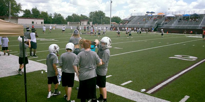 Photo submitted Siloam Springs youth football players huddle up Saturday at the annual 7-on-7 Tournament hosted by the Siloam Springs Football Booster Club at Panther Stadium. More than 20 teams from Northwest Arkansas and the River Valley participated in the tournament. After expenses, the tournament raised around $4,500 to go directly to the Panthers&#8217; football program.