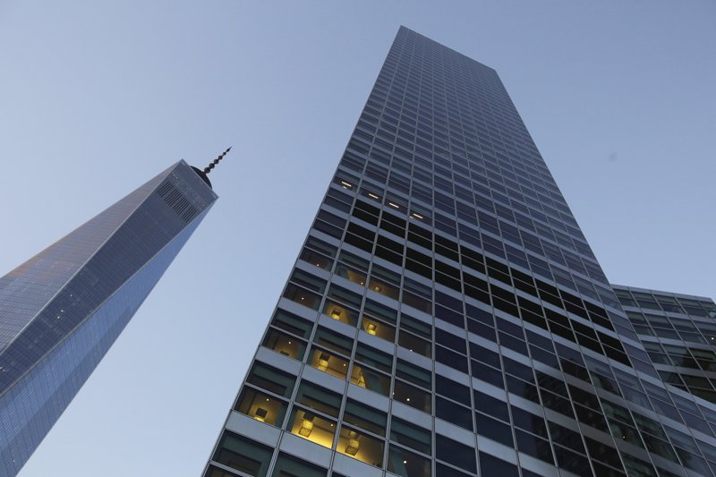 FILE - In this Thursday, Oct. 15, 2015, file photo, Goldman Sachs headquarters, right, neighbors One World Trade Center, in New York. Goldman Sachs, the most Wall Street of Wall Street firms, is pushing quietly into the realm of consumer banking. (AP Photo/Mark Lennihan, File)