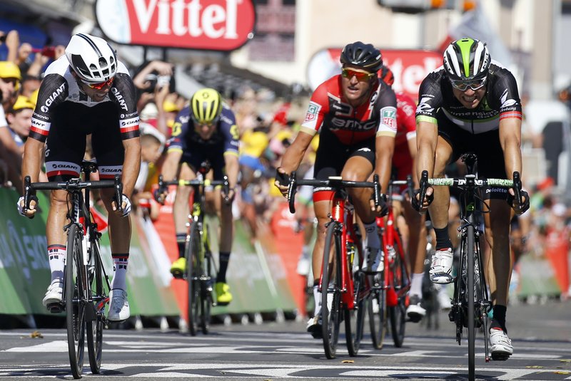 The Associated Press STAGE PRESENCE: Australia's Michael Matthews, left, crosses the finish line to win Stage 16 of the Tour de France Tuesday. Norway's Edvald Boasson Hagen, right, finished second in the 102.5-mile segment.