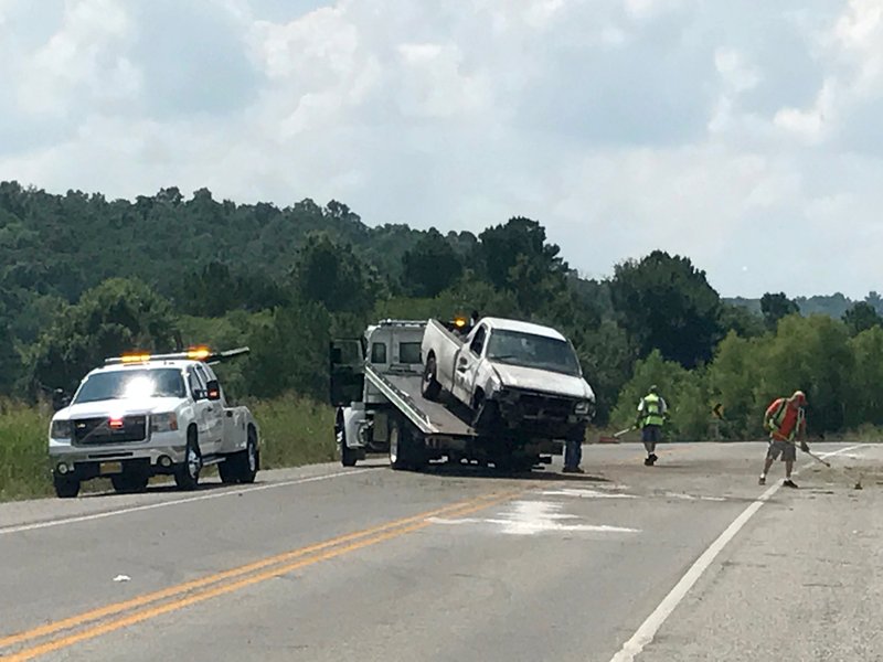 NWA Democrat-Gazette/DAVID GOTTSCHALK
Crews clean up after a one vehicle fatal accident Wednesday, July 19, 2017 on Futral just south of Martin Luther King Junior Boulevard. On the east side of I 49.