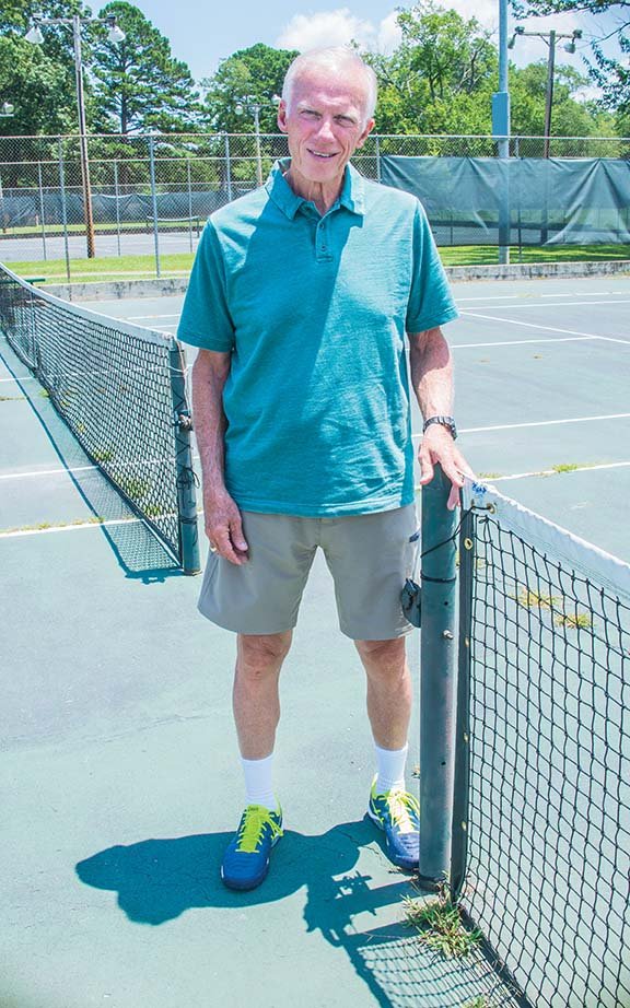 Harold Henderson, longtime tennis coach at Hendrix College, is shown at Laurel Park’s tennis courts, which are old and in disrepair. He is a member of the Conway Area Tennis Association, whose tennis-facility proposal was approved in June by the Conway City Council. The $2.5 million facility will include eight courts at Laurel Park, a pro shop and two viewing/meeting buildings. Work could start next week on the project, said Steve Ibbotson, director of Parks and Recreation.