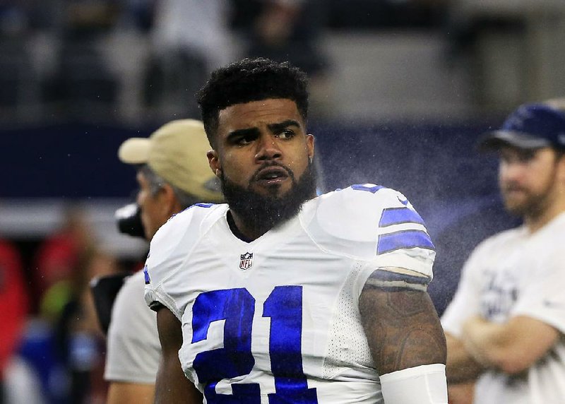 Dallas Cowboys' Ezekiel Elliott stands on the field during warm ups before an NFL football game against the Tampa Bay Buccaneers on Sunday, Dec. 18, 2016, in Arlington, Texas.