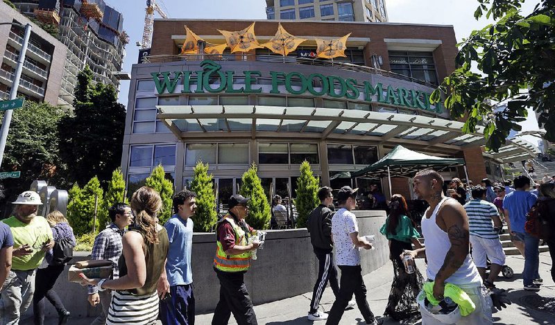 A Whole Foods Market sits just down the street from Amazon headquarters in Seattle. A Whole Foods and Amazon customer in Seattle said the combination of the two “feels like they’re taking over so much commerce in our life.”  