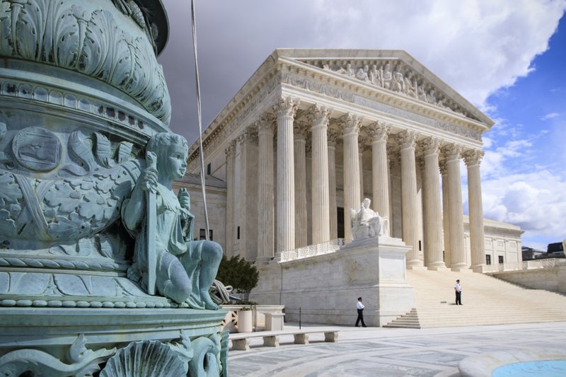 In this photo taken March 28, 2017, the Supreme Court Building is seen in Washington. The Supreme Court is granting the Trump administration's request to more strictly enforce its ban on refugees, at least until a federal appeals court weighs in. But the justices are leaving in place a lower court order that makes it easier for travelers from six mostly Muslim countries to enter the U.S. (AP Photo/J. Scott Applewhite)