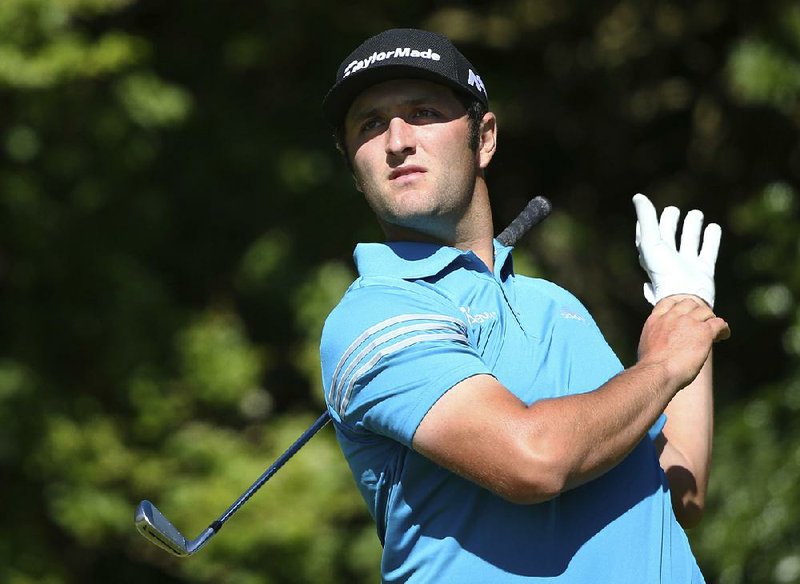 Spain's Jon Rahm watches his shot off the 5th tee during the first round of the British Open Golf Championship, at Royal Birkdale, Southport, England Thursday, July 20, 2017. 