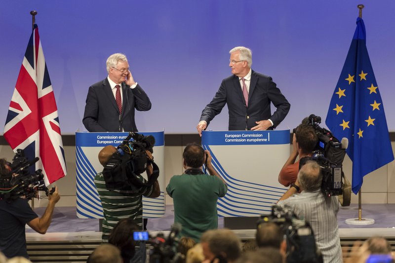 The EU chief Brexit negotiator Michel Barnier, right, and British Secretary of State David Davis address the media after a week of negotiations at EU headquarters in Brussels, Thursday July 20, 2017. UK's chief Brexit negotiator says week of talks with EU has given"us a lot to be positive about". (AP Photo/Geert Vanden Wijngaert)
