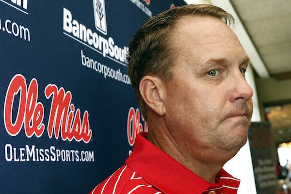 In this Tuesday, July 18, 2017 photo, Mississippi football coach Hugh Freeze considers a response to a question as he speaks to reporters during a Rebel Road Trip to visit with alumni and athletic supporters in Jackson, Miss. Mississippi announced Thursday, July 20, that Freeze resigned after five seasons, bringing a stunning end to a once-promising tenure. Offensive line coach Matt Luke has been named interim coach. (AP Photo/Rogelio V. Solis)