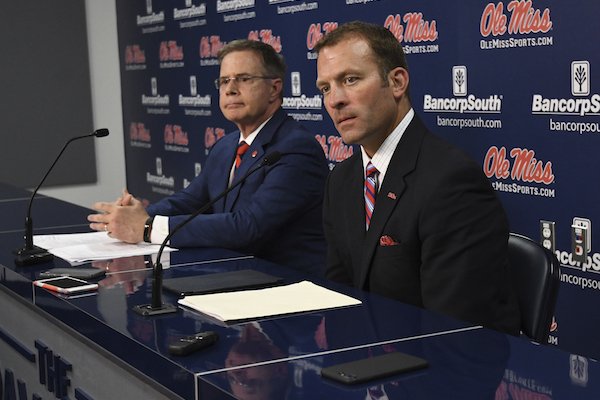 University of Mississippi Chancellor Jeffrey Vitter, left, and athletic director Ross Bjork speak at a news conference about the resignation of football coach Hugh Freeze, in Oxford, Miss., Thursday, July 20, 2017. (Bruce Newman/Oxford Eagle via AP)