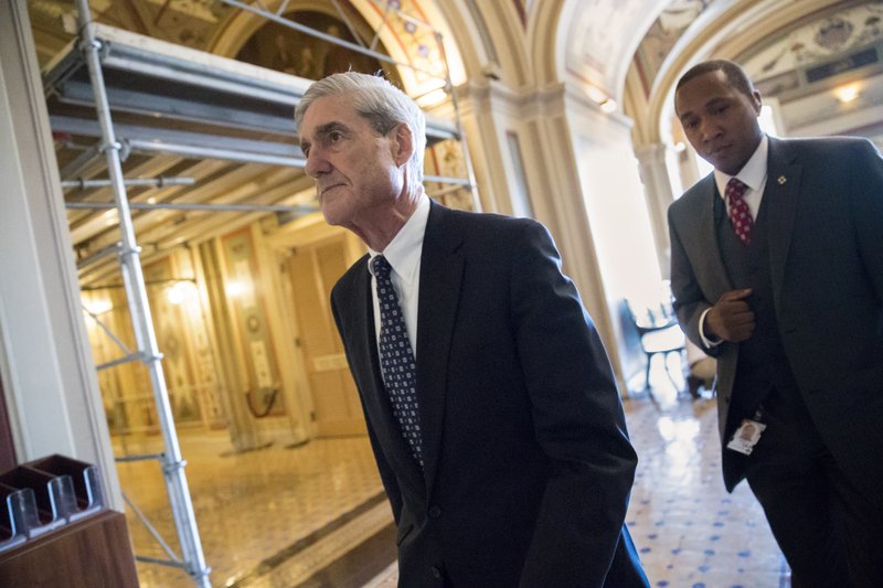 FILE - In this June 21, 2017 file photo, special counsel Robert Mueller departs after a closed-door meeting with members of the Senate Judiciary Committee about Russian meddling in the election and possible connection to the Trump campaign, at the Capitol in Washington. President Donald Trump's legal team is evaluating potential conflicts of interest among members of Mueller's investigative team, according to three people with knowledge of the matter. The revelations come as Mueller's probe into Russia’s election meddling appears likely to include some of the Trump family's business ties. (AP Photo/J. Scott Applewhite, File)
