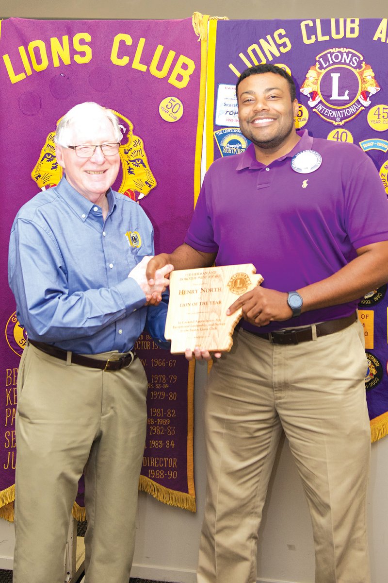 Searcy Lions Club secretary Bob Simpson, left, poses with Henry North, who was named Lion of the Year. North said the award is an outstanding honor.