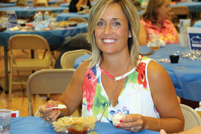 Bryant mayor Jill Dabbs prepares to sample a variety of selections at the 2017 Taste of Bryant. Kim Leech, the organizer for the 18th annual Taste of Bryant, said this year’s event will feature a VIP room for the first time. The event will be held Aug. 3 at Bishop Park. 