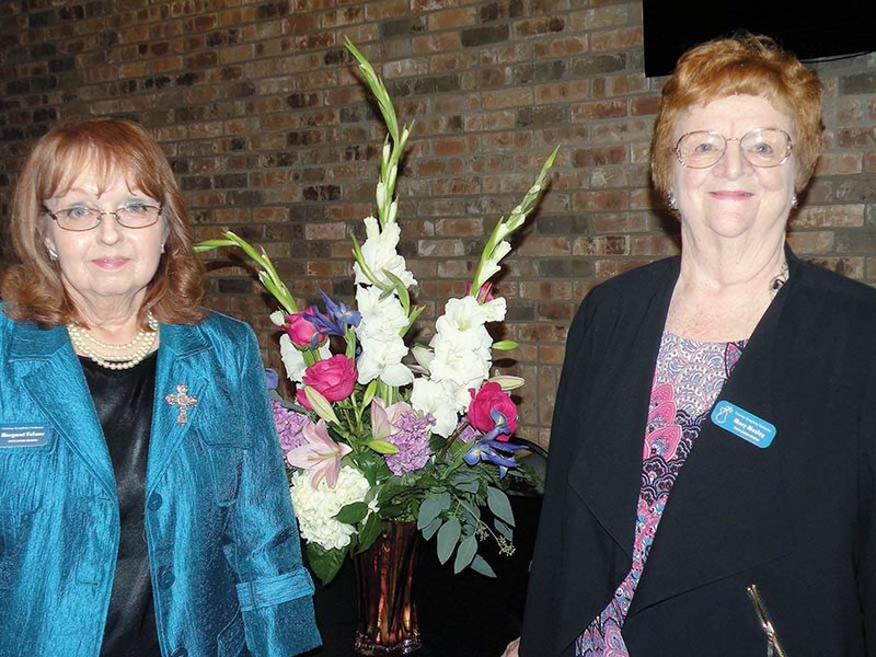 Mary H. Mosley, right, outgoing president of the Conway Symphony Orchestra Guild Board of Directors, poses with Margaret Palmer, who was installed as the new board president June 16 at the guild’s annual meeting. The guild’s board of directors honored Mosley with the establishment of the Dr. Mary H. Mosley Orchestra Student Assistance Fund.