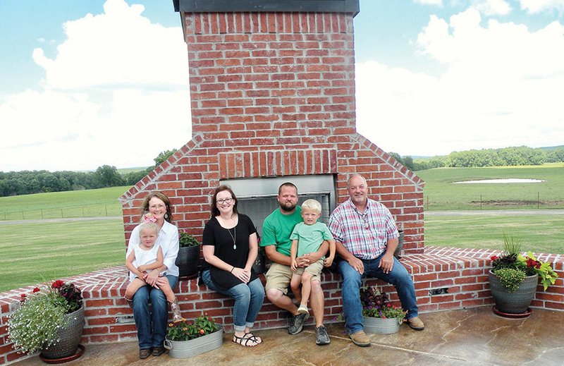 The David “Butch” Hoyt family of Houston is the 2017 Perry County Farm Family of the Year. Family members include, from left, Kay Hoyt, holding 3-year-old Amelia Green; Debbie Green; Kyle Green, holding 5-year-old Lane Green; and David “Butch” Hoyt. Not shown is Eric Hoyt, who lives in Arlington, Texas. The family raises cattle and hay on 375 acres.