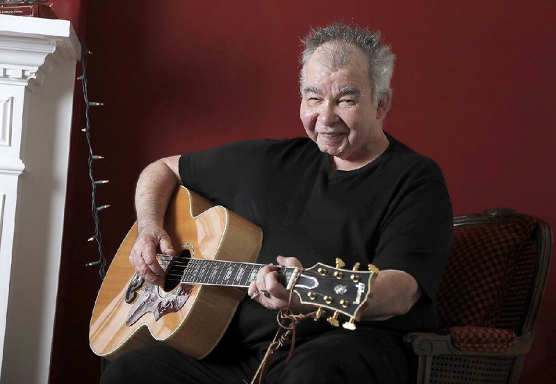 John Prine plays guitar in his Nashville, Tenn., office. 