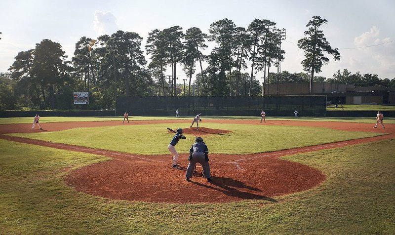 The Royals and the Cubs compete during league play at Lamar Porter Field in Little Rock. The teams are part of Little Rock’s Reviving Baseball in Inner Cities youth baseball league. 