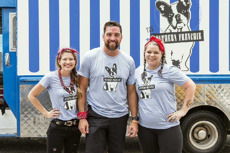 Chef Donnie Ferneau of Little Rock (center), his wife Meaghan (left) and his sous chef Amanda Ivy star in Food Network's The Great Food Truck Race. 
