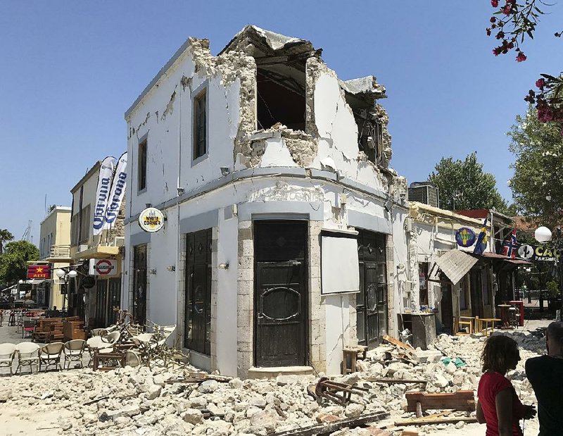 Rubble sits outside a bar where two people were killed after an earthquake Friday on the island of Kos, Greece.