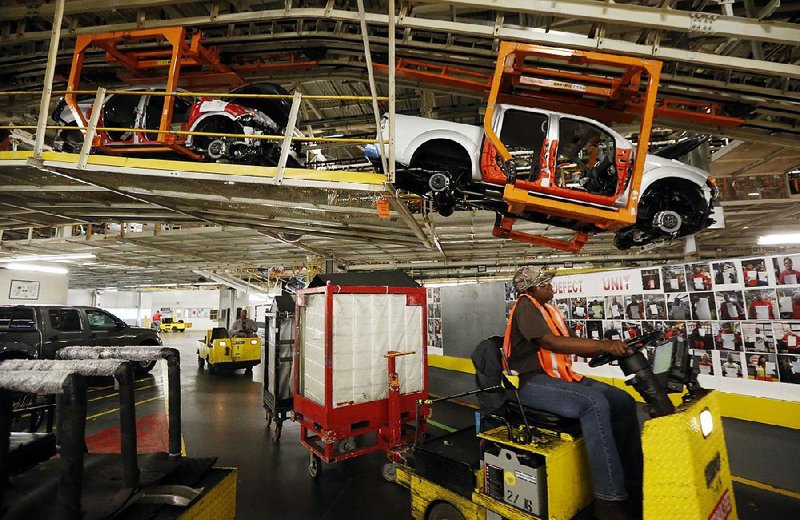 Pickup frames are suspended on the assembly line at the Nissan Canton Vehicle Assembly Plant in Canton, Miss., in April 2016. An employee vote at the plant on United Auto Worker representation is set for Aug. 3 and Aug. 4.