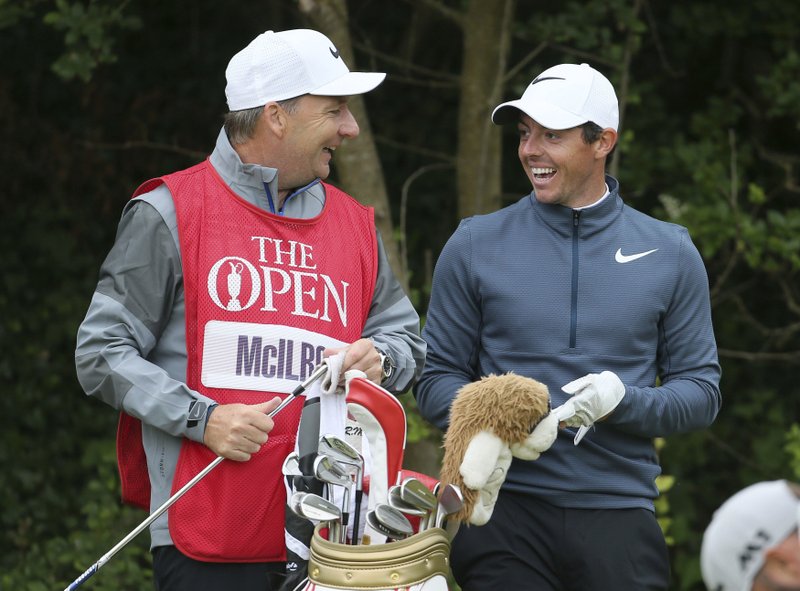 Northern Ireland's Rory McIlroy speaks with his caddie JP Fitzgerald during the second round of the British Open Golf Championship at Royal Birkdale,, Southport, Friday July 21, 2017. 