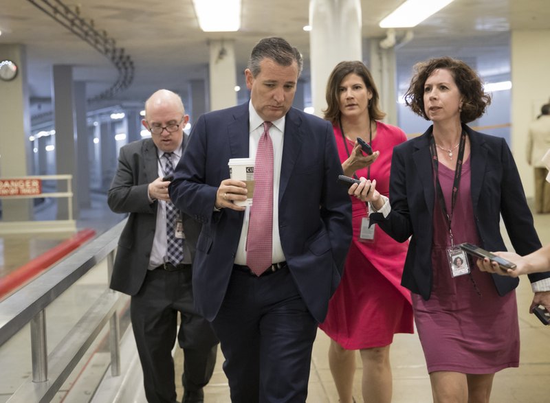 Sen. Ted Cruz, R-Texas, heads to the chamber for a vote, on Capitol Hill in Washington, Thursday, July 20, 2017. Majority Leader Mitch McConnell is spurring Republican senators to resolve internal disputes that have pushed their marquee health care bill to the brink of oblivion, a situation made more difficult for the GOP because of Sen. John McCain's jarring diagnosis of brain cancer. 