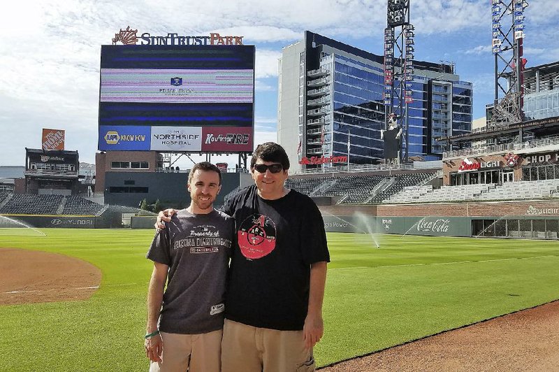 Frank Gennario Jr. (right) and his son, Tony, completed their quest to watch the Arizona Diamondbacks at every major league stadium earlier this month at Atlanta’s SunTrust Park.
