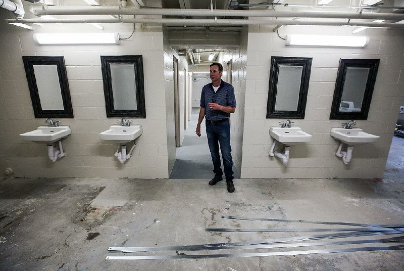 David Mann, a representative of Depaul USA, talks Thursday about renovations to the basement of the Jericho Way homeless resource center in Little Rock. New sinks, showers, and washers and dryers will give the center’s clients more space for cleaning up. 