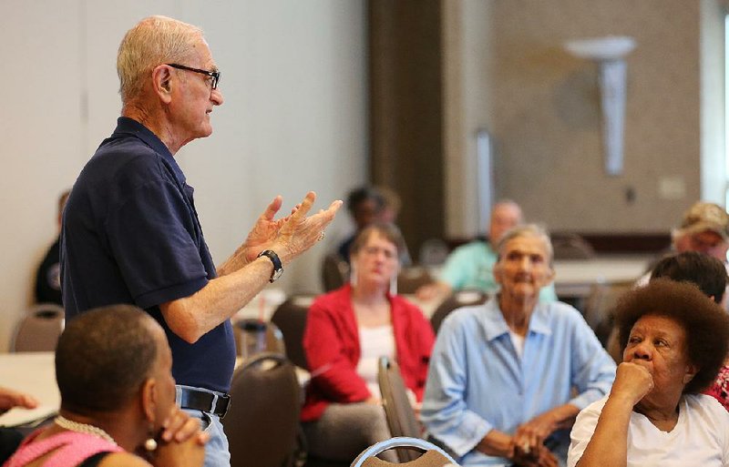 North Little Rock resident Joe Whalen asks a question to Mayor Joe Smith during a meeting Thursday about the Aug. 8 vote on a 1 percentage point sales tax increase. 