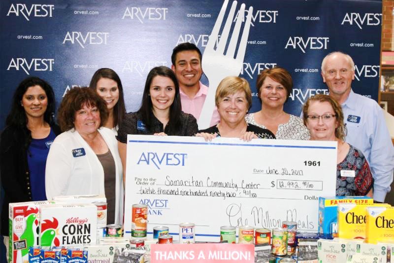 The Samaritan Community Center has received funds from this year’s Arvest 1 Million Meals Campaign. The
$12,992.90 financial donation will support SCC’s SnackPacks for Kids program during the 2017-18 academic
year, and the 1,073 canned food items will be given out through the Samaritan Market food pantry. The money
and in-kind donations were collected at Rogers’ Arvest banking locations. Every year Arvest launches its 1
Million Meals campaign to help fight hunger in the four-state area. This year, the banks and their customers
raised a total of 1,881,283 meals. Pictured are Arvest Rogers employees Regina Velliz (from back row, left),
Whitney Johnson, Julian Hernandez, Michella Seawright and Greg Stanfill; and Arvest Rogers employees Katy
Leis (front row) and Kelly Hutchison, Debbie Rambo, SCC executive director, and Shannon Green, SCC in-kind
donation manager.