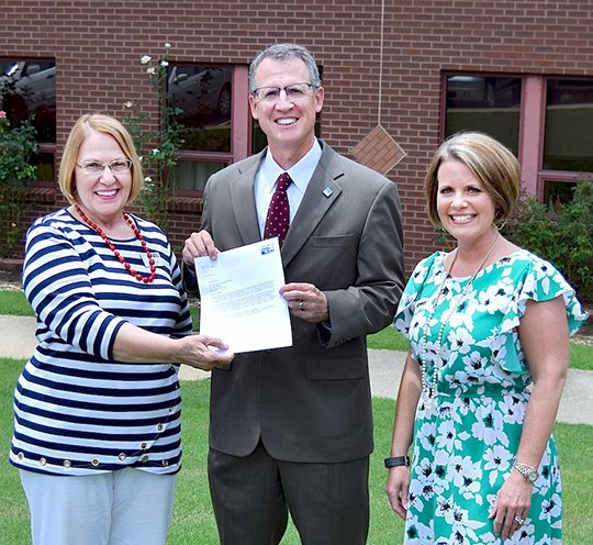 Submitted photo United Way of the Ouachitas Executive Director Jane Browning, left, recently presented a gift of $5,000 to National Park College from the Oaklawn Foundation Wellness Fund. The fund was created to help students in need. Services provided by the fund include food, transportation, medical care, hygiene products and dental services. Also pictured are NPC President John Hogan, center, and Sara Brown, director of development.