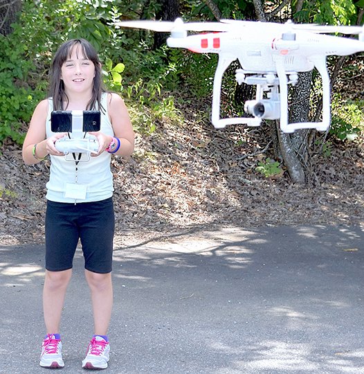 Submitted photo Catherine Spicer, a student from the Bryant School District, flew a Phantom 3 Standard drone when she attended a Drone Camp this month at National Park College's Innovative Technologies Center.