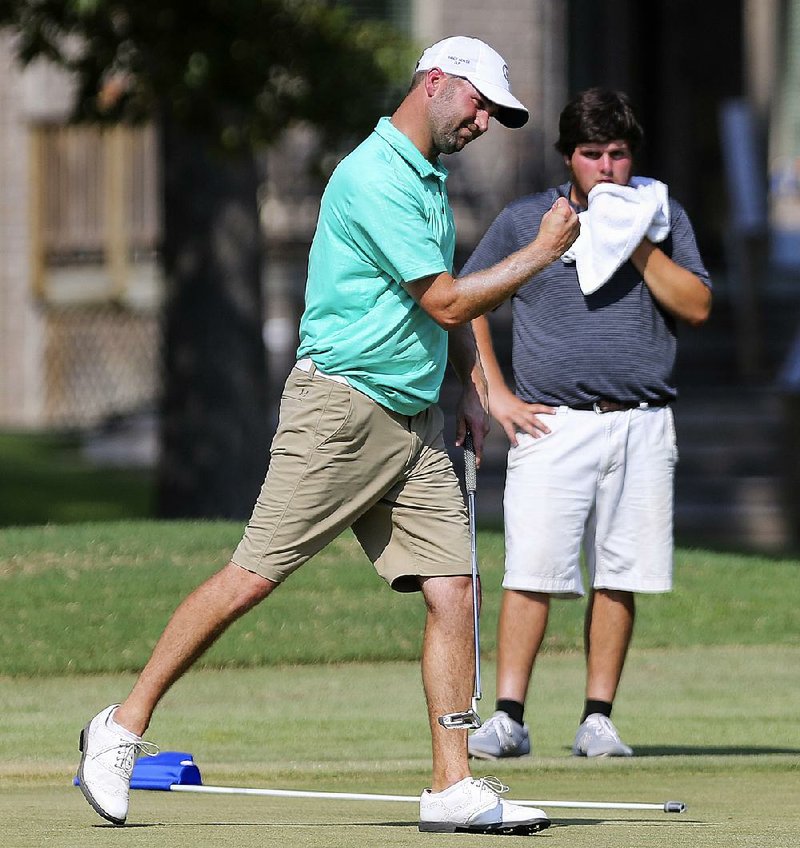 Stafford Gray of Lonoke reacts after sinking a birdie putt on the 18th hole to outlast Austin Harmon and win the Maumelle Classic on Sunday at Maumelle Country Club.