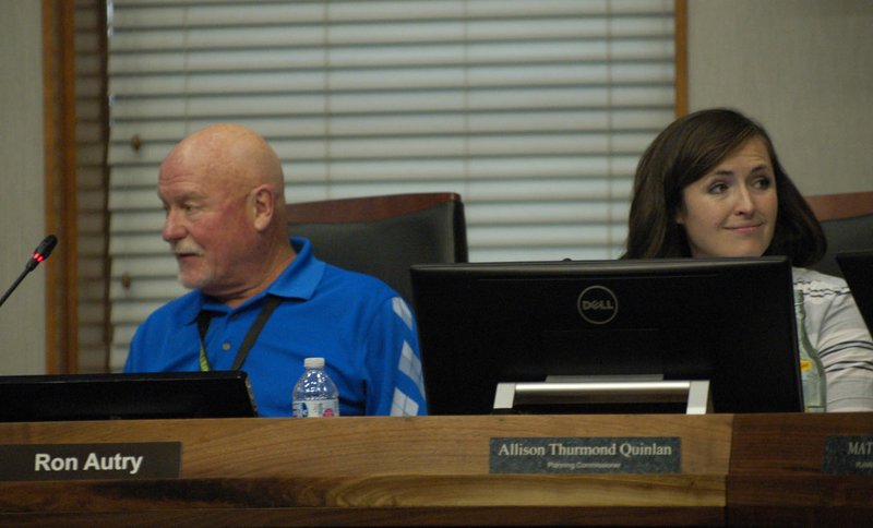 NWA Democrat-Gazette/STACY RYBURN Ron Autry, chairman of the Fayetteville Planning Commission, and Alli Quinlan, treasurer, take part in a commission meeting Monday, July 24, 2017, at City Hall.