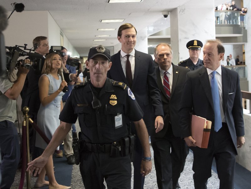White House senior adviser Jared Kushner, center, accompanied by his attorney Abbe Lowell, right, arrives on Capitol Hill in Washington., Monday, July 24, 2017, to meet behind closed doors before the Senate Intelligence Committee on the investigation into possible collusion between Russian officials and the Trump campaign. (AP Photo/J. Scott Applewhite)
